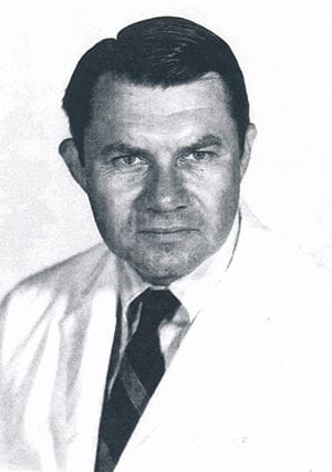 black and white portrait of Dr. Nordschow wearing a white lab coat and tie.