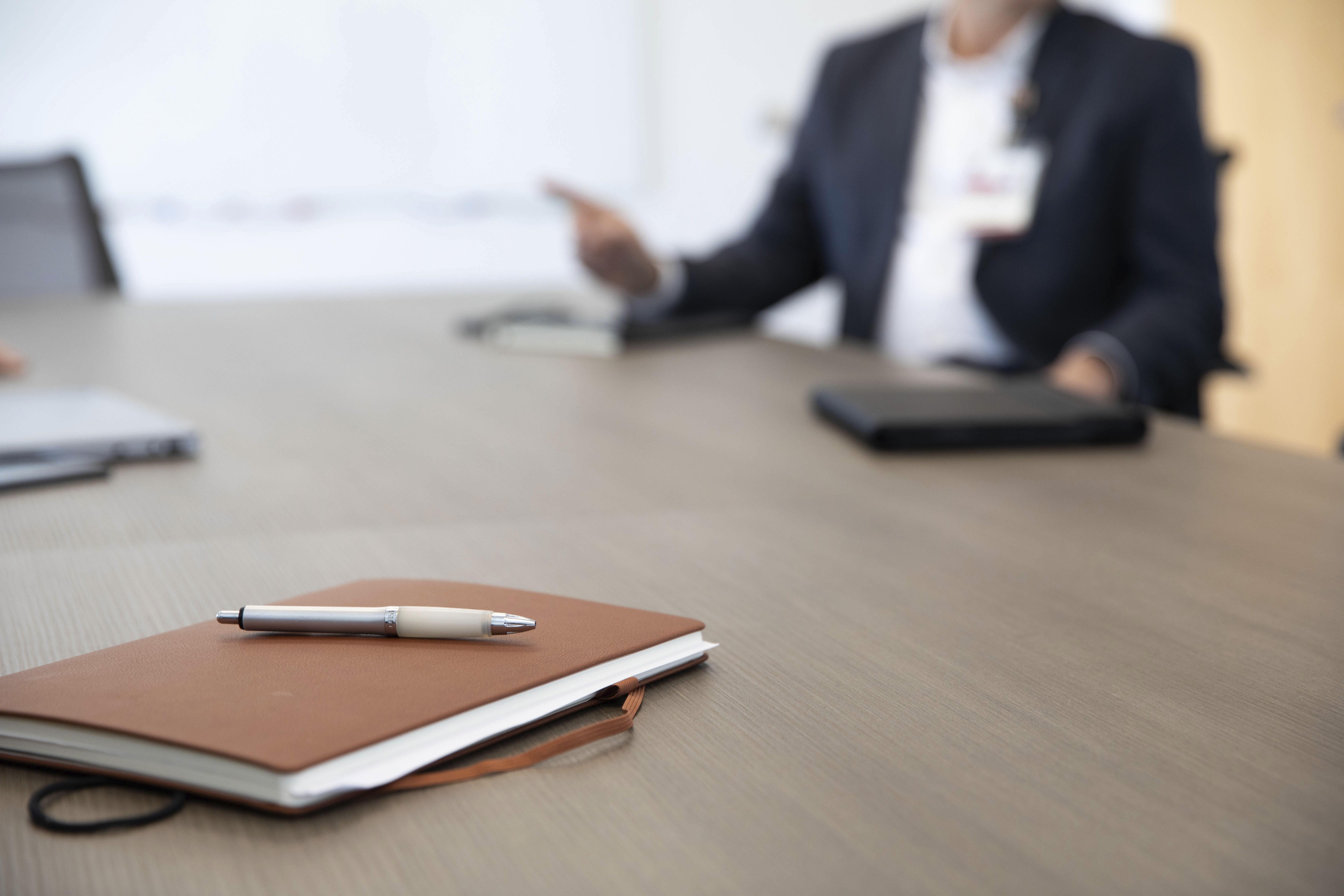 Notebook on a table in a conference room