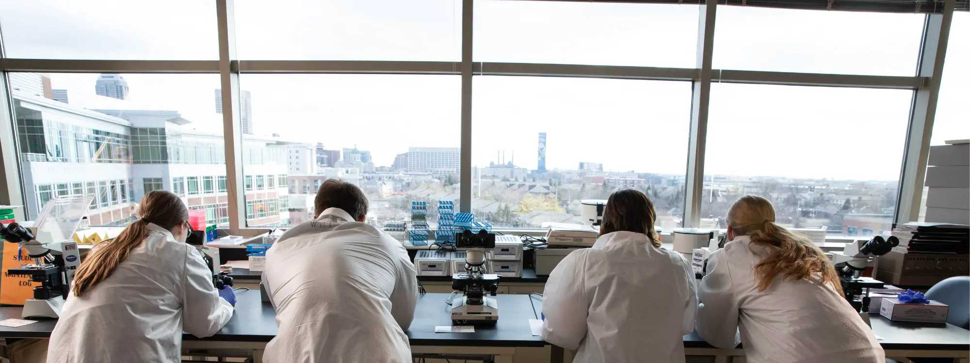 Four students in the Indiana University Pathology Lab