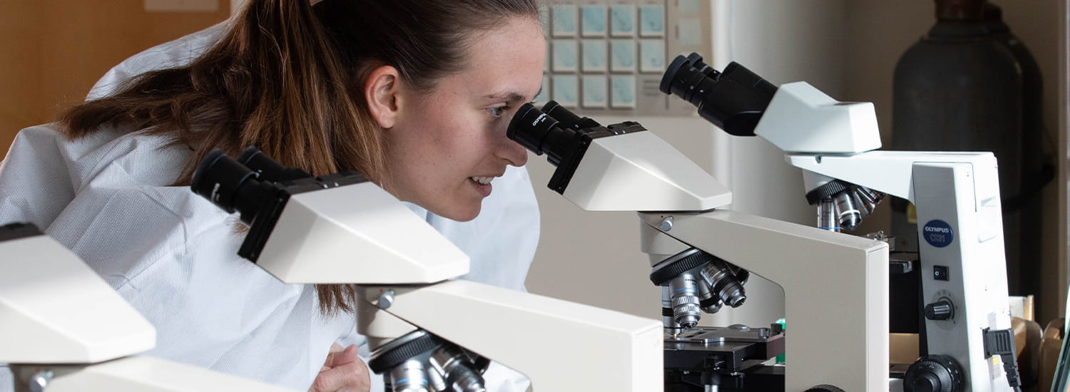 Pathology professional in utilizing lab equipment