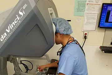 Doctor using a surgical machine.