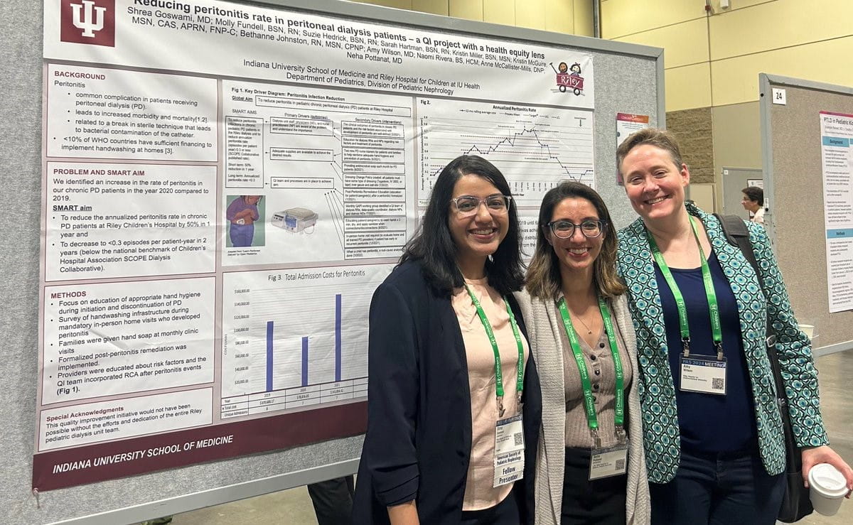 Fellows Amy, Neha, and Shrea with their research poster
