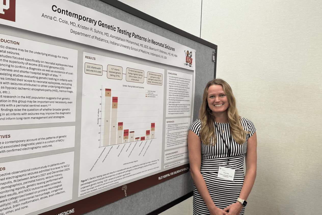 Woman presenting a poster at a conference