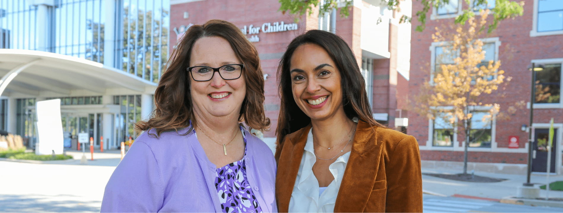 Staff and faculty in the Department of Pediatrics in front of Simon Family Tower