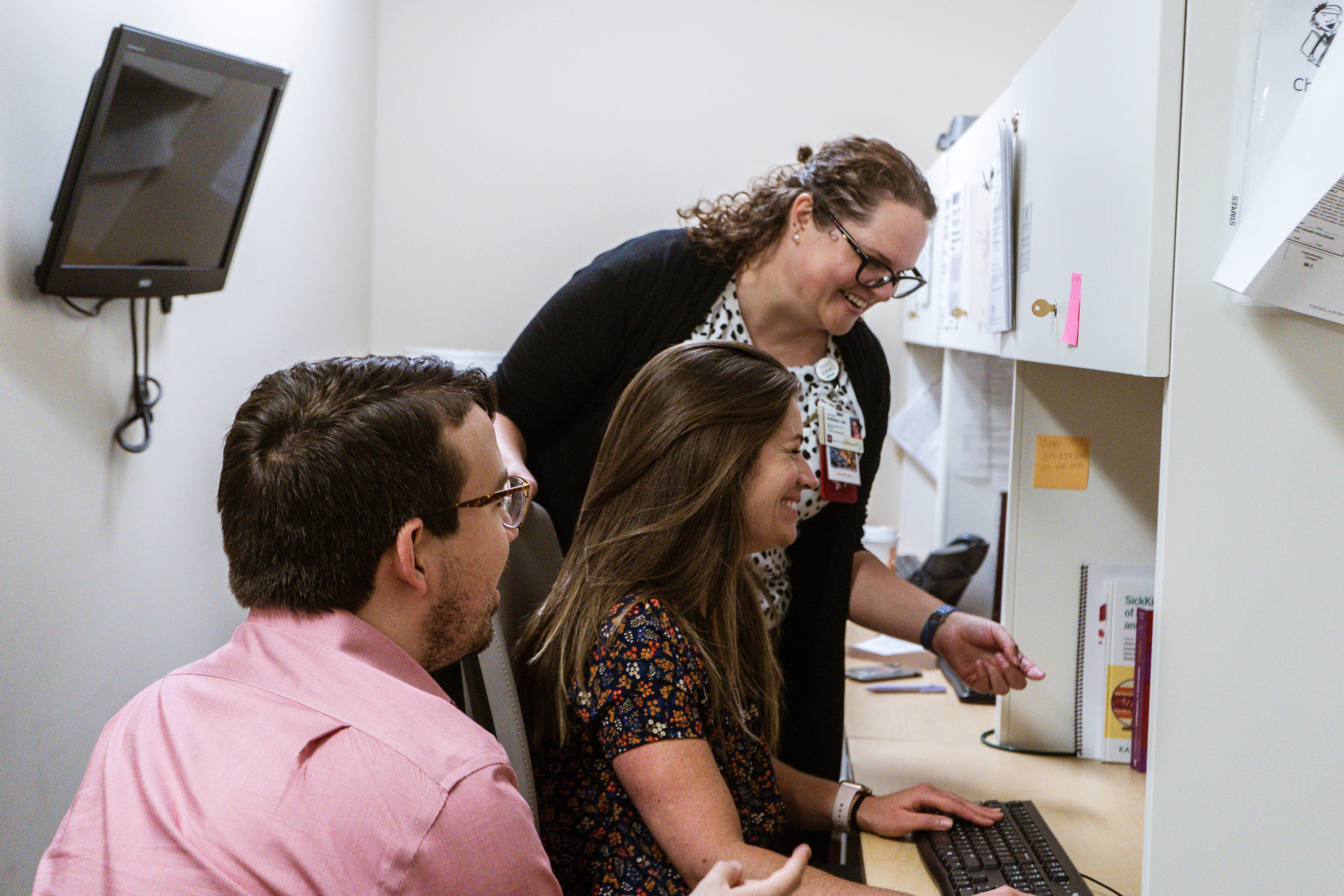 trainees and faculty work together in the hematology staff room