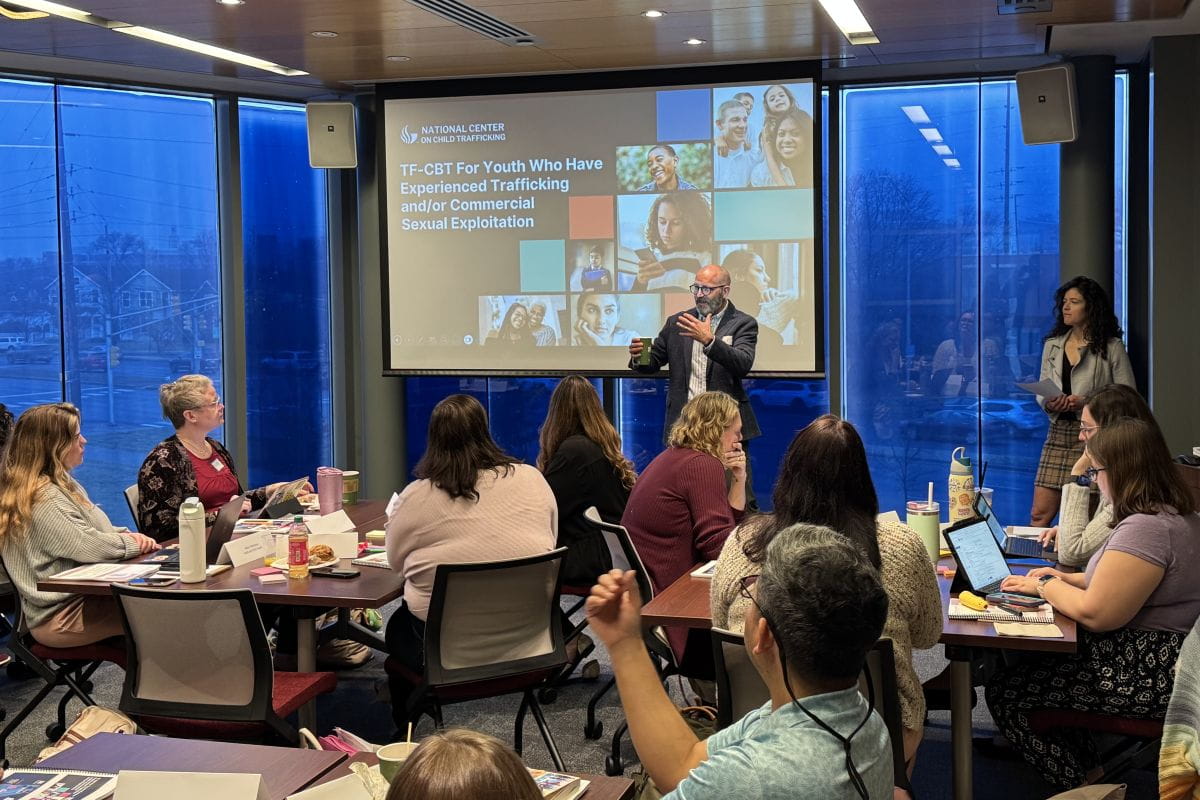 Matt Aalsma giving a presentation in front of a room of people