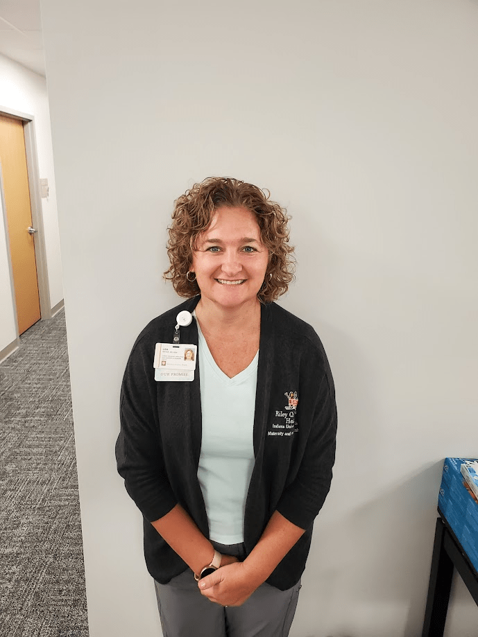 Headshot of woman in a black jacket