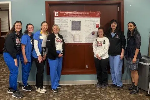 Group of healthcare providers presenting their poster