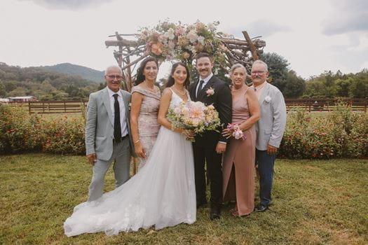 Family picture from Malko’s wedding in August of 2024. From left to right: Malko’s father, Homer Malko, Malko’s mother, Bella Malko, Rada Malko, Malko’s husband, Trever Walker, Malko’s mother-in-law, Elizabeth Walker, and Malko’s father-in-law, Mitchell Walker.