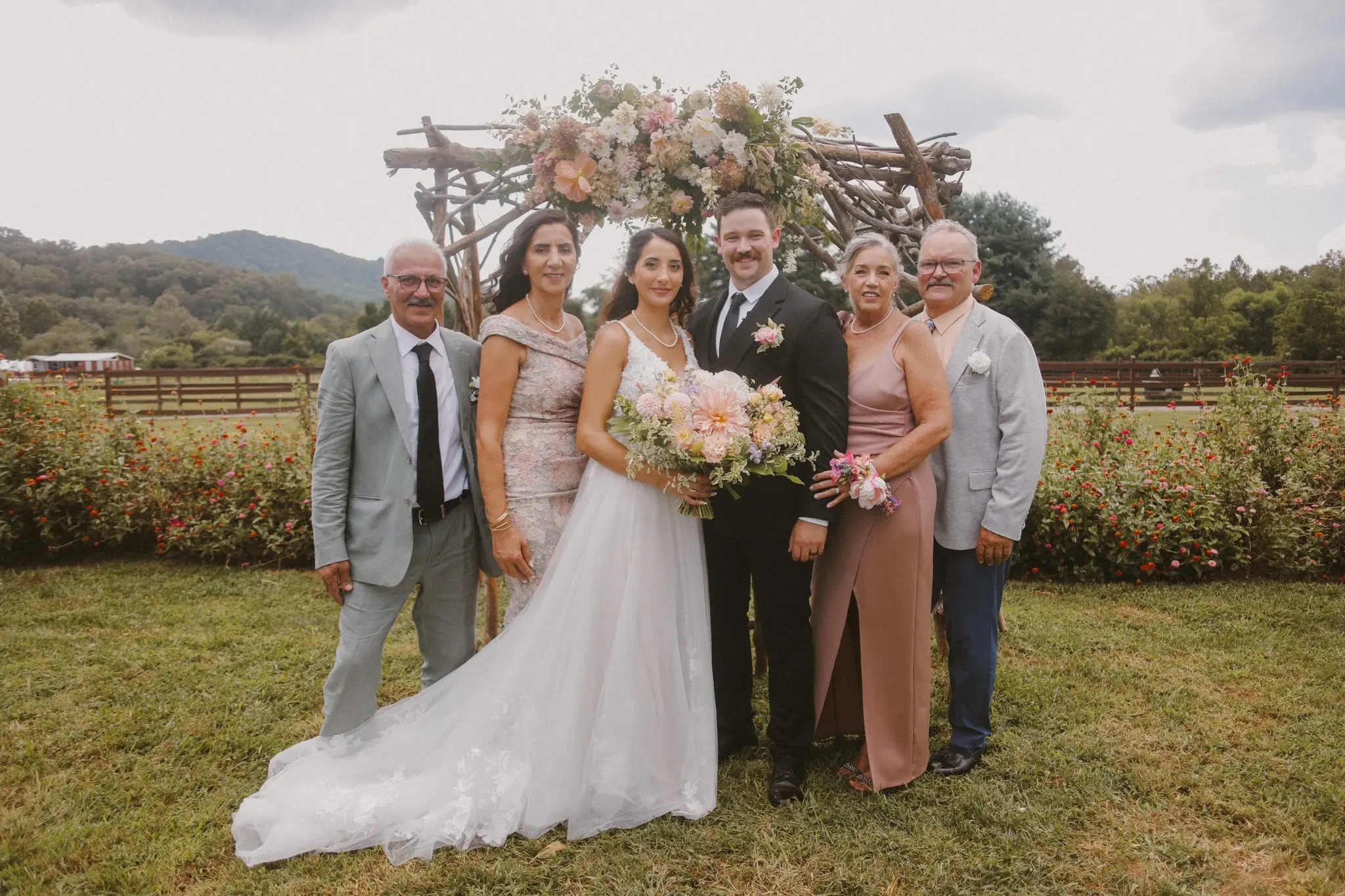 Family picture from Malko’s wedding in August of 2024. From left to right: Malko’s father, Homer Malko, Malko’s mother, Bella Malko, Rada Malko, Malko’s husband, Trever Walker, Malko’s mother-in-law, Elizabeth Walker, and Malko’s father-in-law, Mitchell Walker.