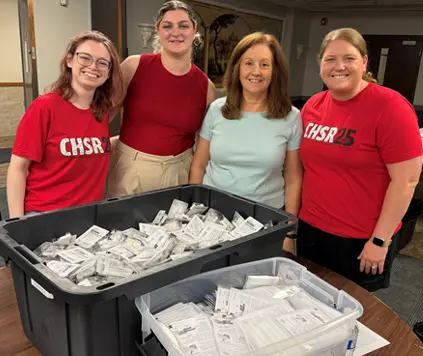 HEART Lab team members Kacie, Rachel, Angela, and Annie pack overdose kits for Overdose Lifeline