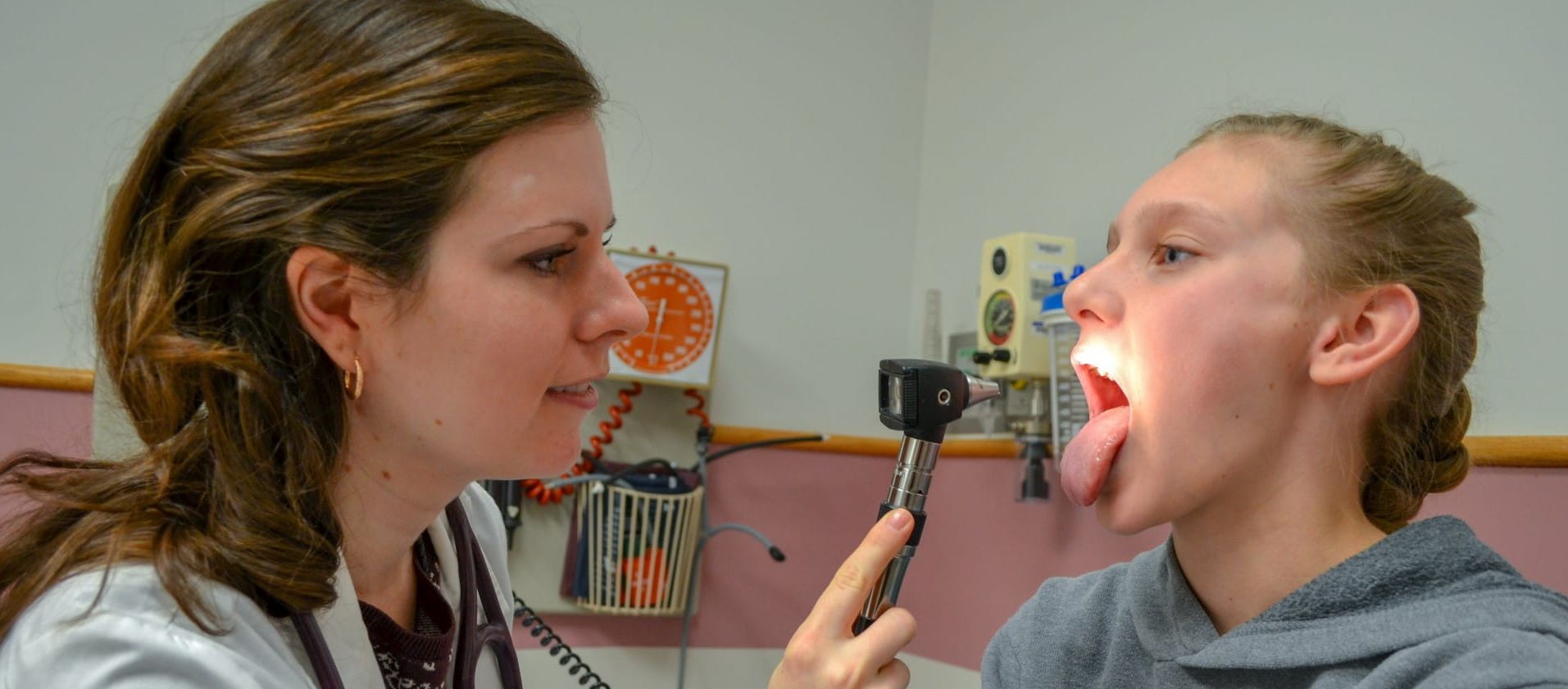 Adolescent Medicine fellow with patient