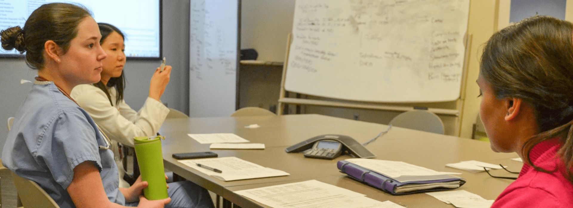 Pediatric endocrinology fellow discusses patients on rounds with medical students.