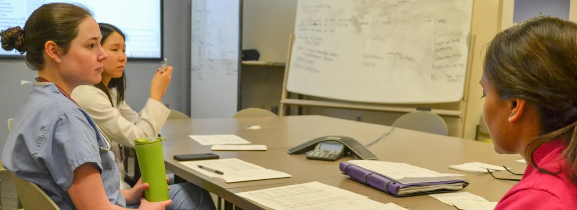 Pediatric endocrinology fellow discusses patients on rounds with medical students.