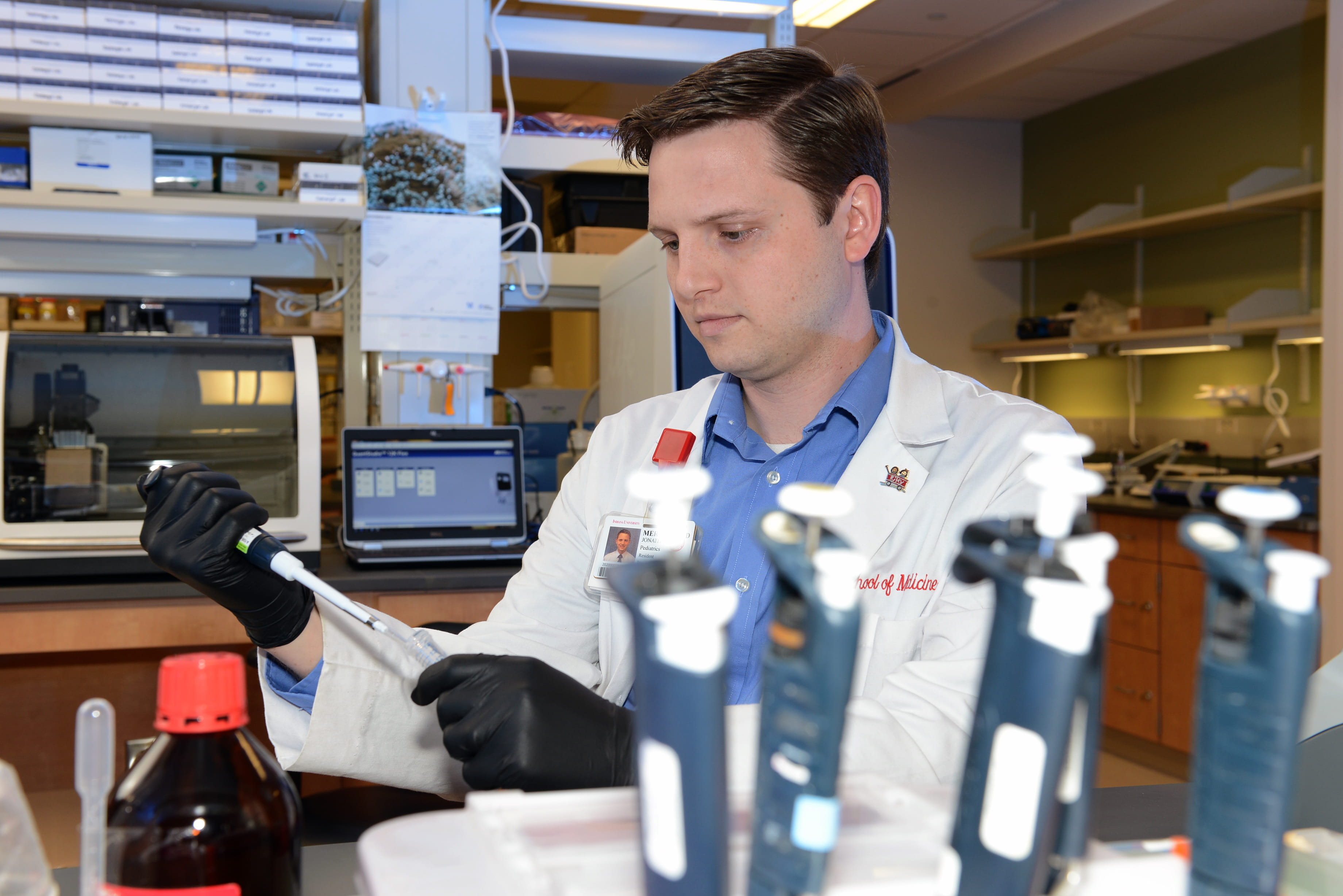 Jon Merrell, MD, works in the lab in the Wells Center for Pediatric Research