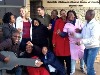 Members from the Carlucci lab laughing and posing for a photo