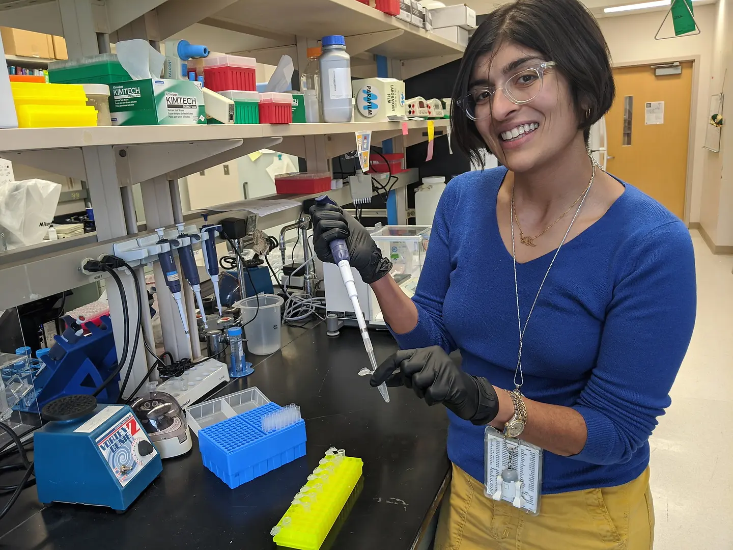 Samina Bhumbra holding a pipette