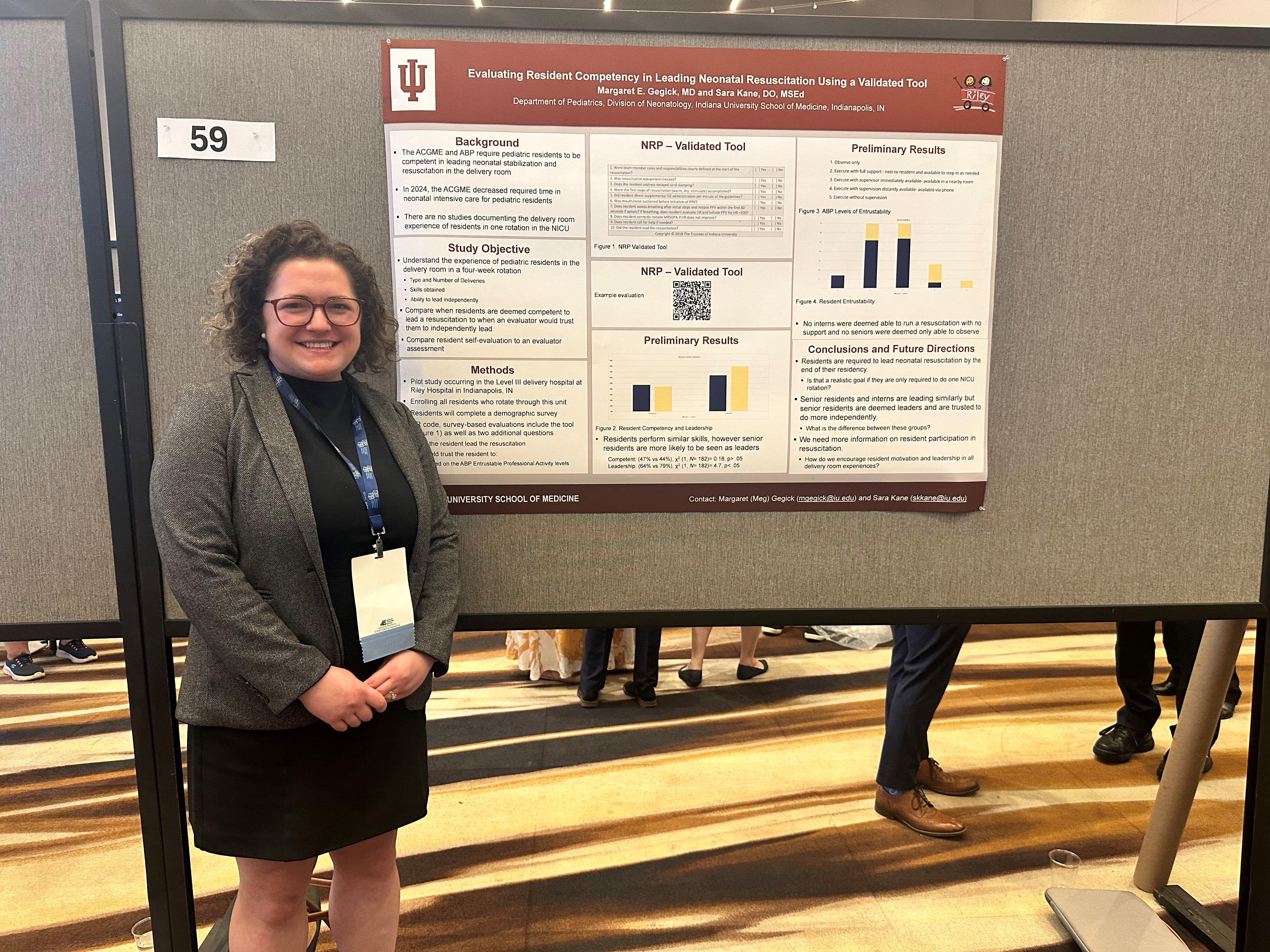 Women in jacket presenting a poster