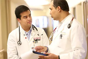 Two providers discussing their notes