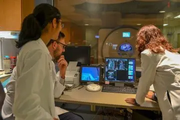 Three physicians review test results.  