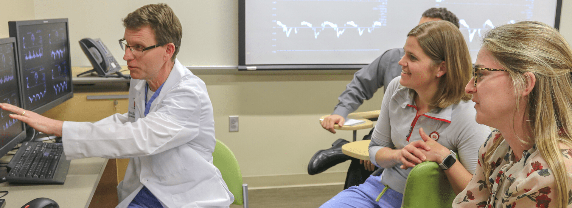 Eric Ebenroth, MD, evaluates echocardiograms with pediatric cardiology fellows