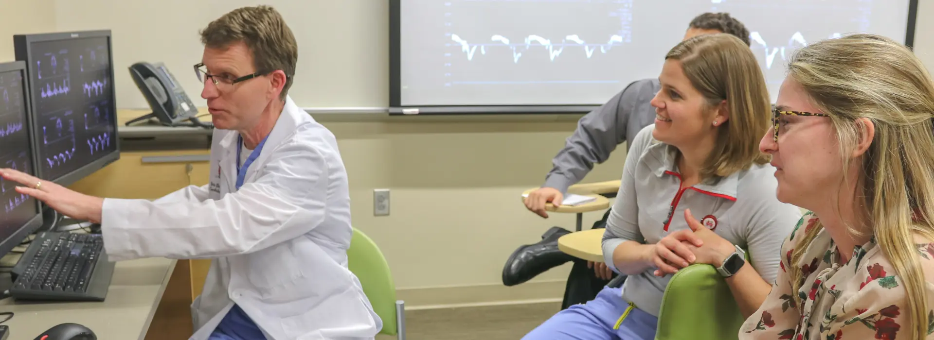 Eric Ebenroth, MD, evaluates echocardiograms with pediatric cardiology fellows