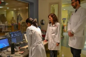 Physicians review result of tests.