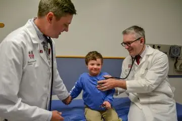 Two provider caring for a patient