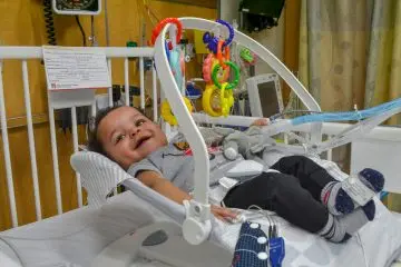 A pediatric patient in a hospital bed