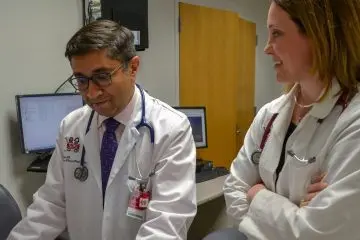 Two providers working at a computer