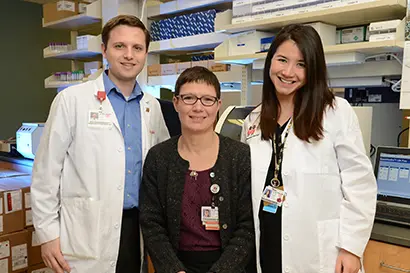 Three people at the Pediatric Translational Research Center