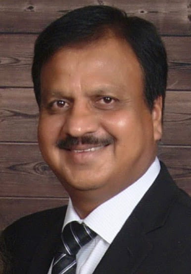 Headshot of a man with a wood plank background