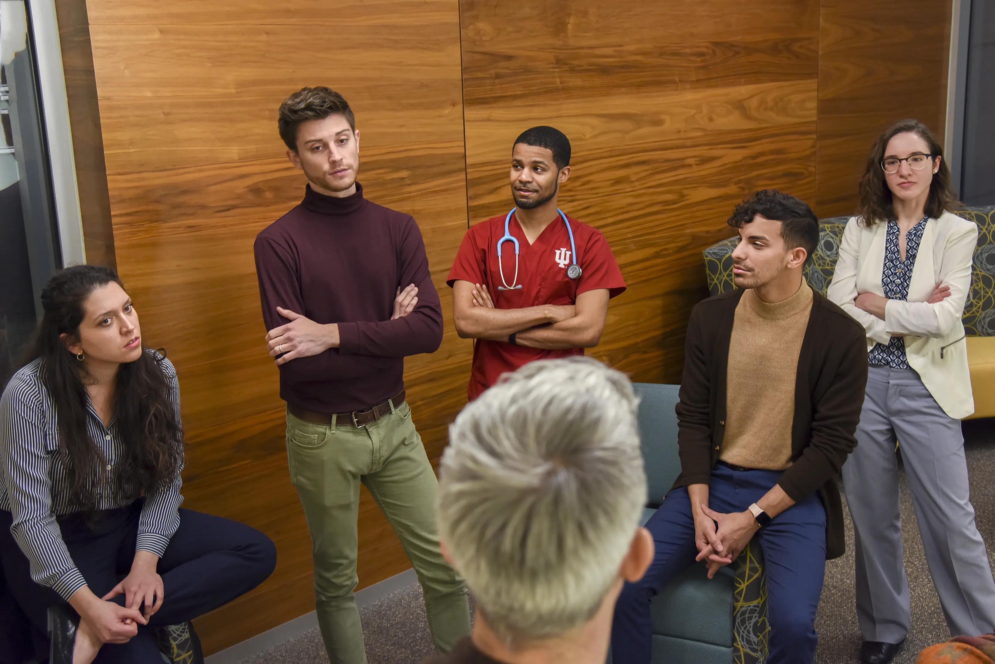 OutCare team members listen to psychiatry resident, Dustin Nowaskie, MD. From left to right, Sara Garcia-Dehbozorgi, Jordan Nowaskie, Jared Riley, Christopher Roman and Abby Hadley.