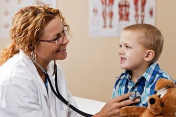 A pediatrician with a patient