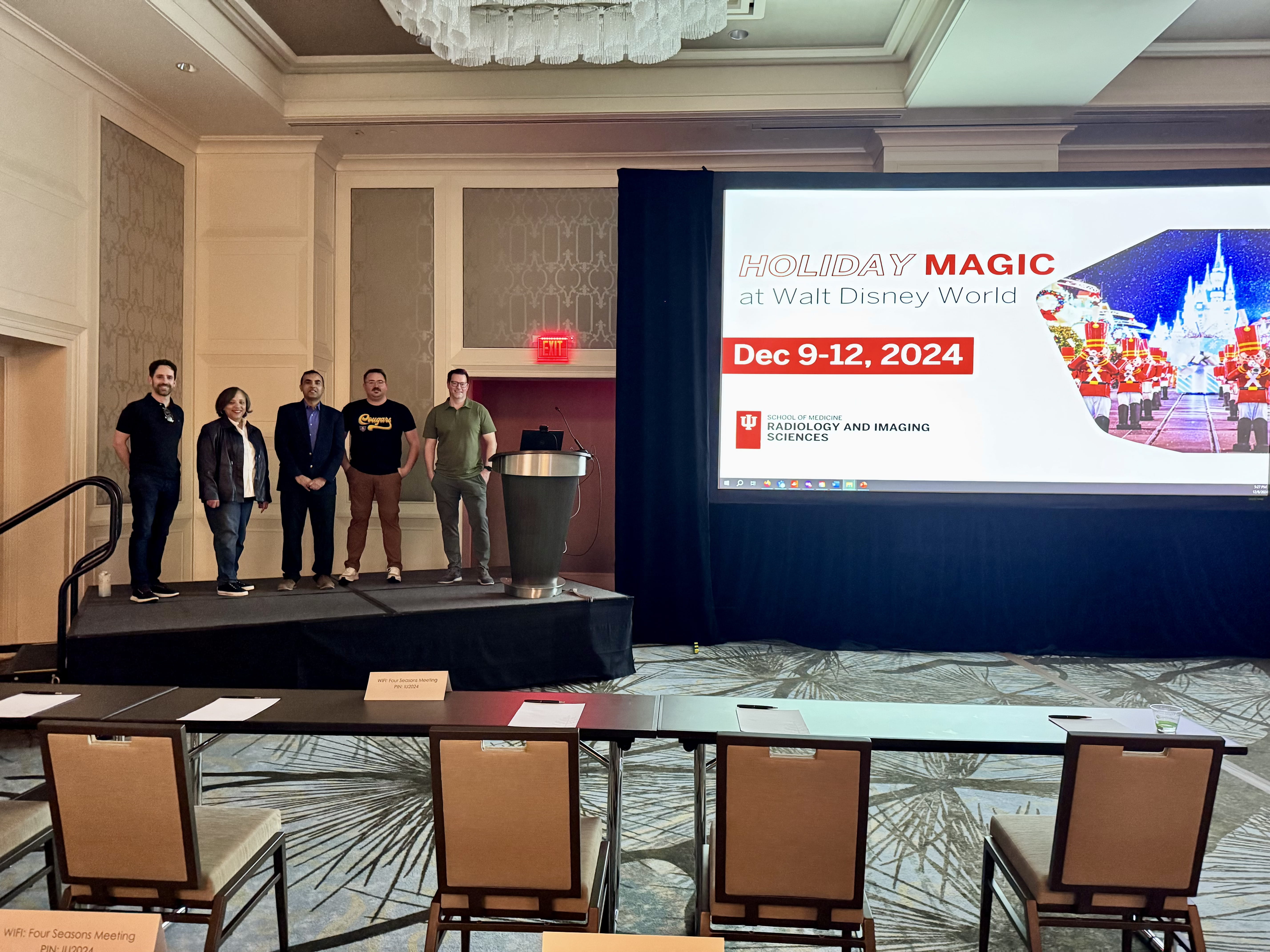 Faculty/staff pose together at a CME event.