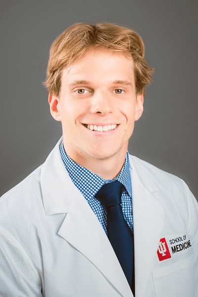 Conner Barnes in a white coat