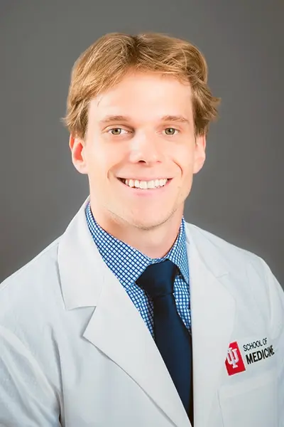 Conner Barnes in a white coat