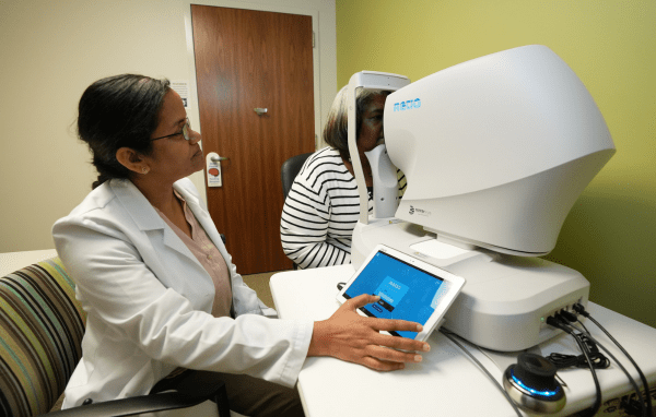 Physician observing a patient's eyes