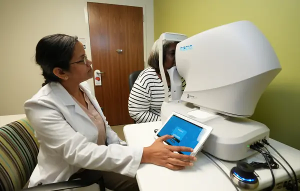 Physician observing a patient's eyes