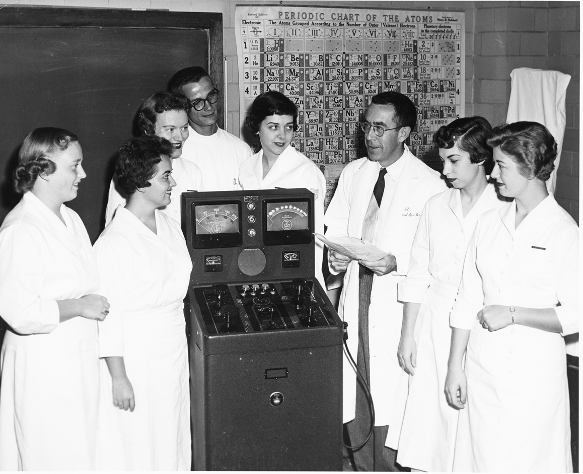 Dr. John Campbell and a trainee group with x-ray equipment.