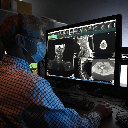 a physician reviews imaging