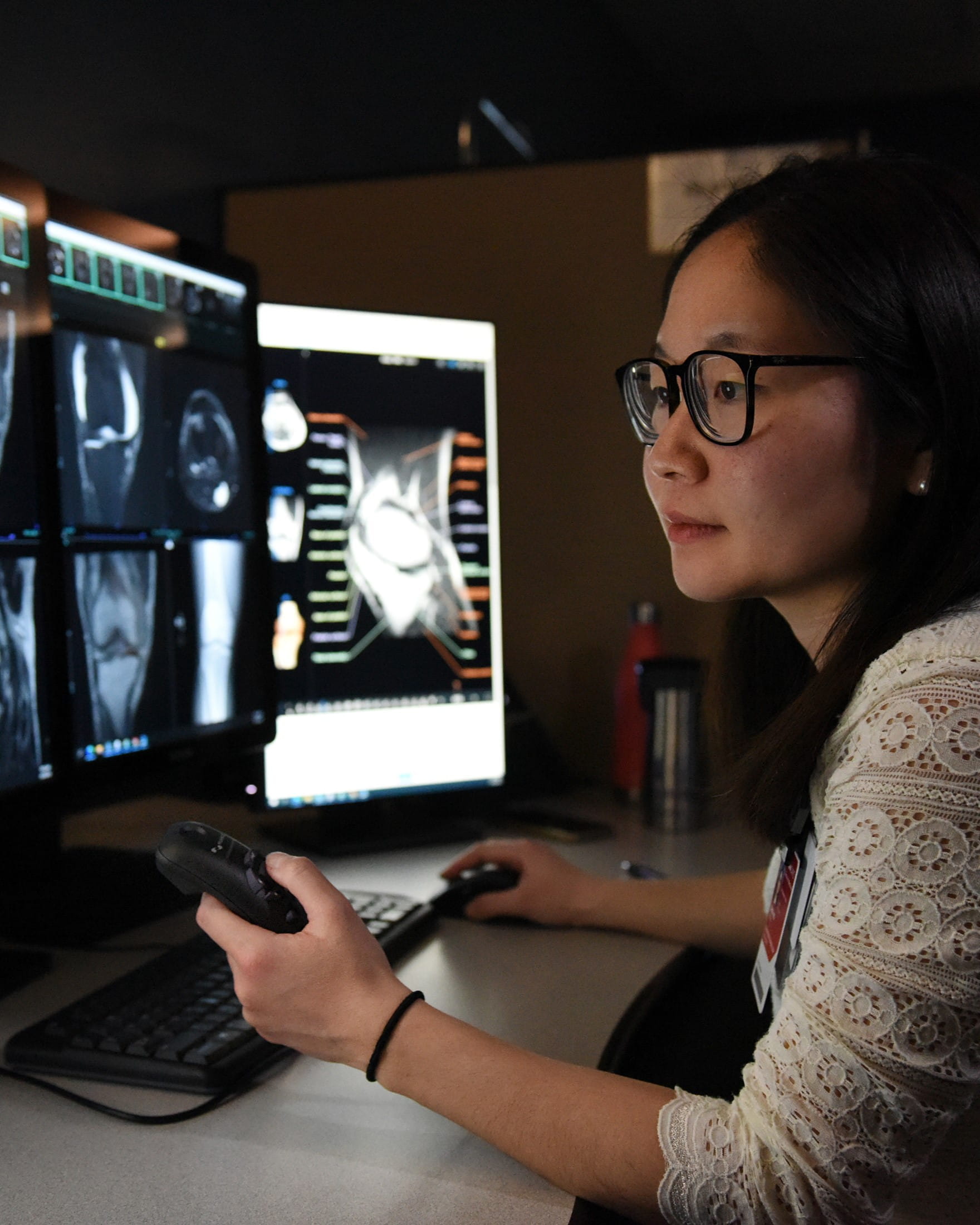 female radiologist viewing skeletal scans.