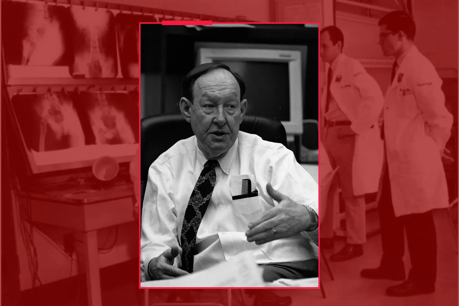 Black and white image of Robert Holden on a red background.
