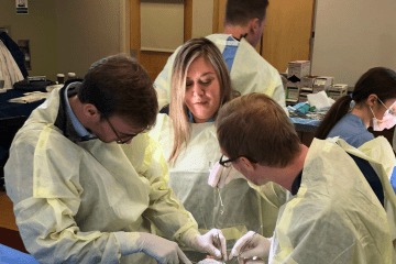 two residents participating in hands skills lab with Dr. Mary Lester