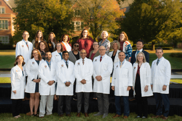 Fall 2023 Group picture of Dept of Surgery Education Team, surgical leadership in the white coats