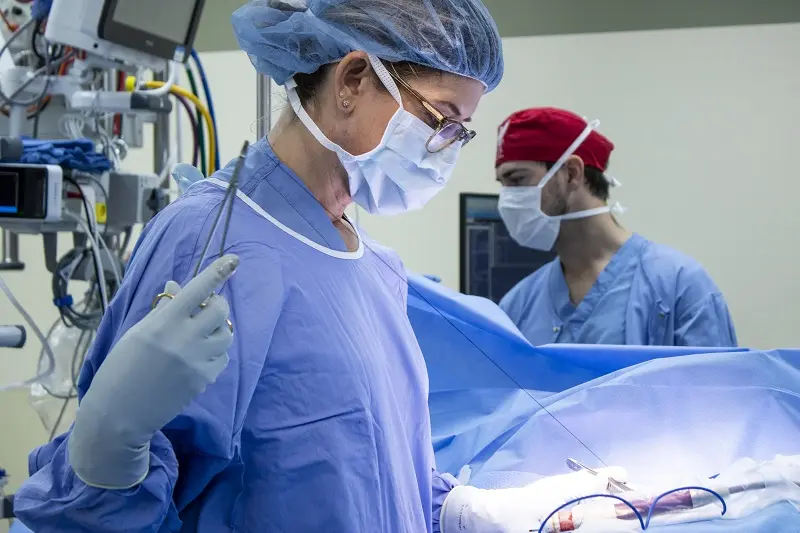 Photo of  Carla Fisher MD, doing a operation
