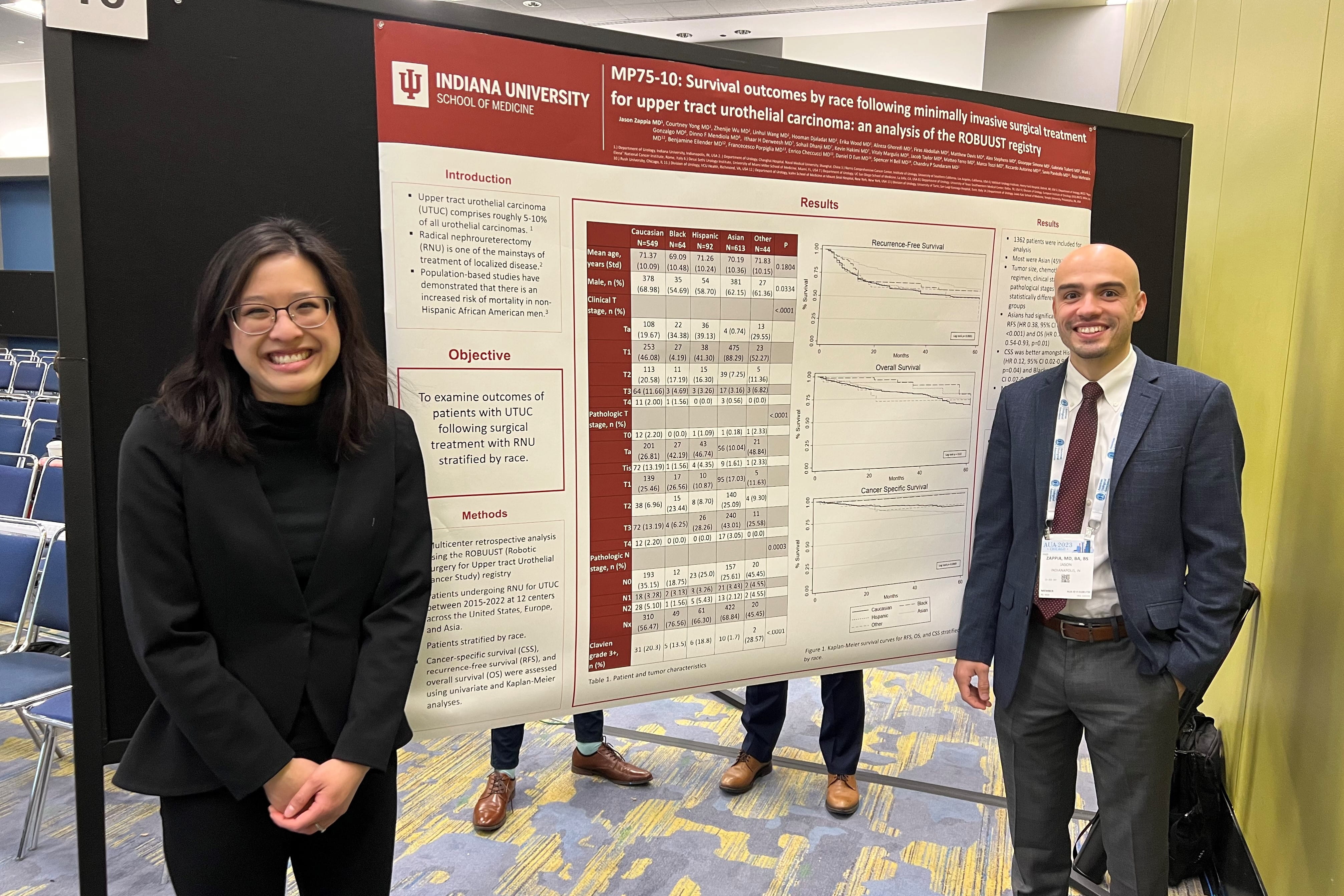 two urology trainees present research at a poster event
