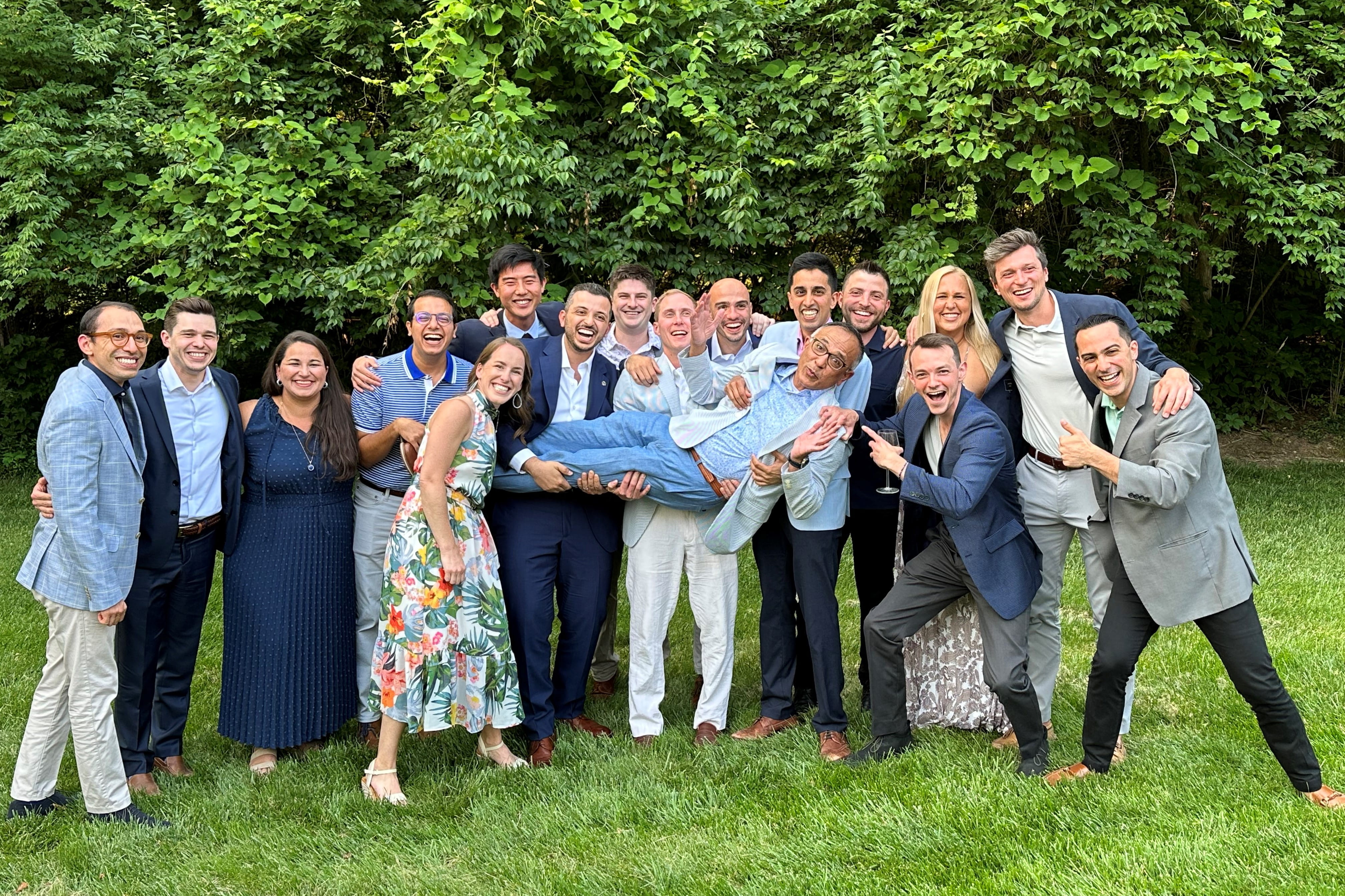 a large group of residents dressed up and smiling together