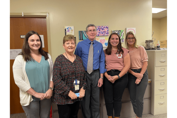 Hibbard and Hicks stand with three female fellows