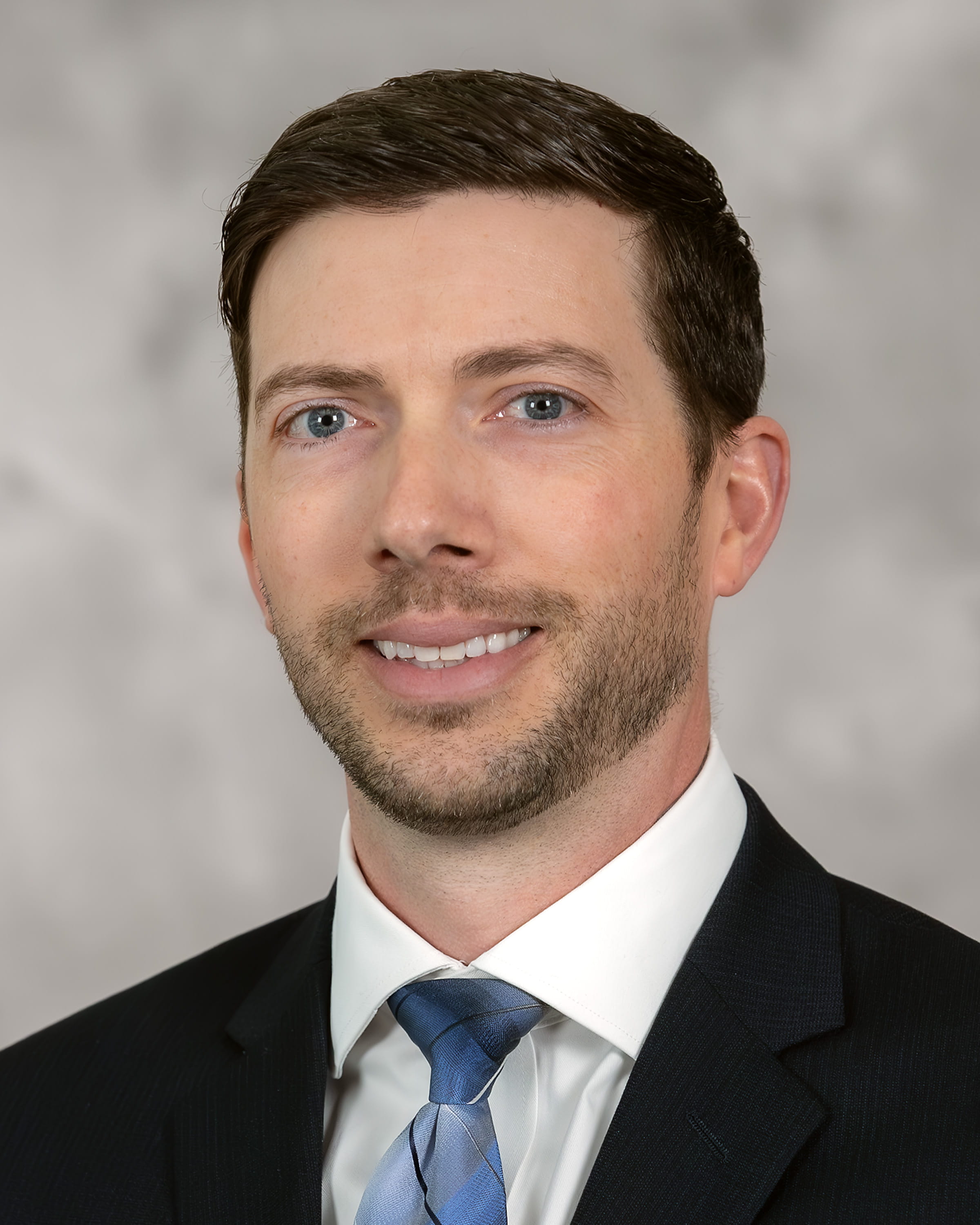 Man in suit smiling for camera